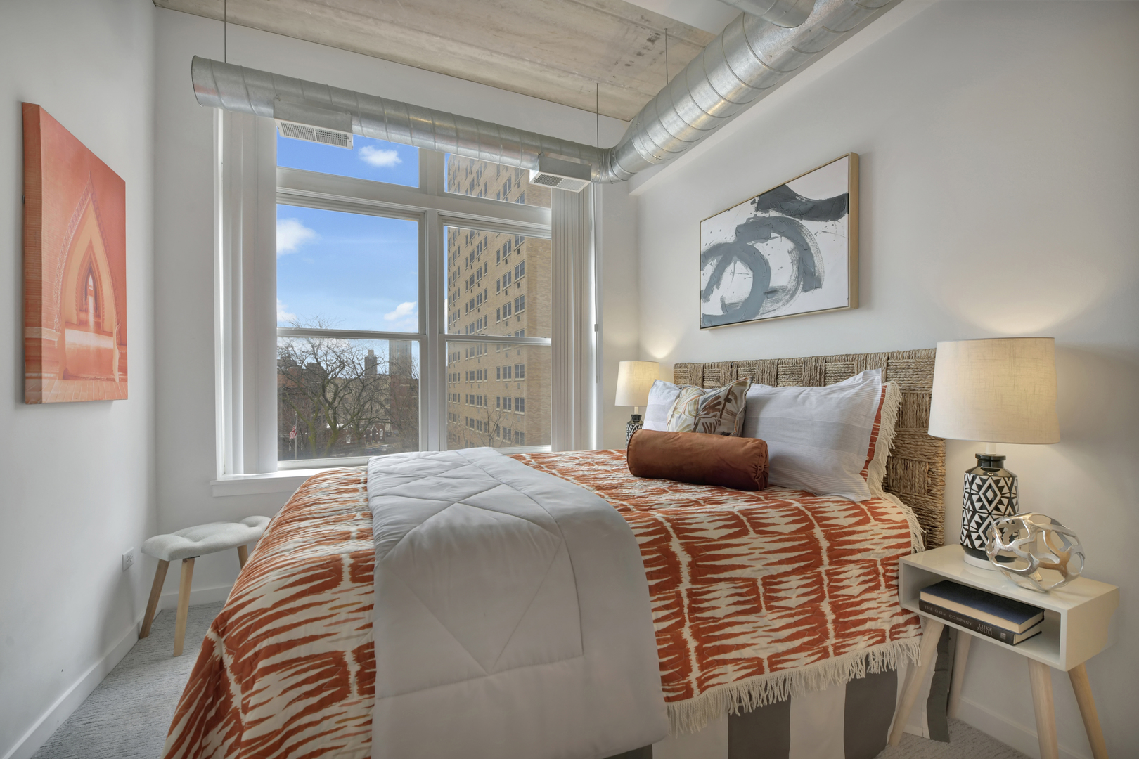 3260 North Clark Street, Unit 407 Chicago, IL 60657 - Photo 13 of 18 a bedroom with a bed and a window