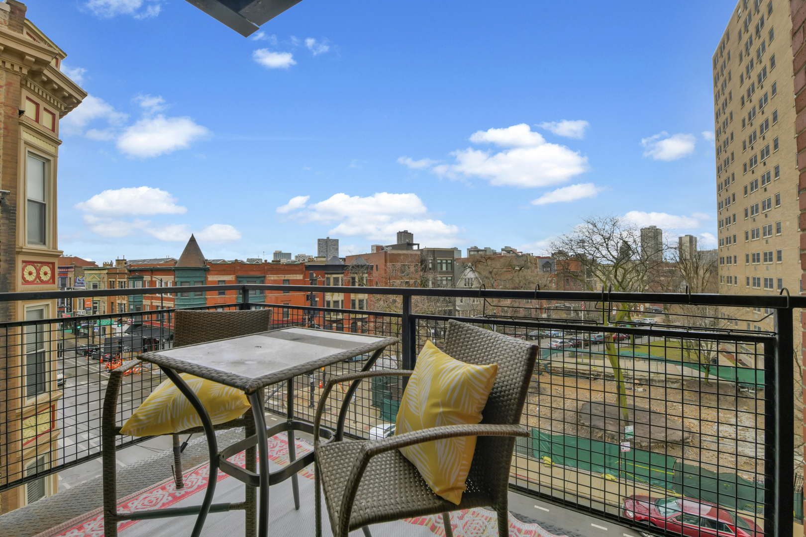 3260 North Clark Street, Unit 407 Chicago, IL 60657 - Photo 16 of 18 a view of a balcony with furniture
