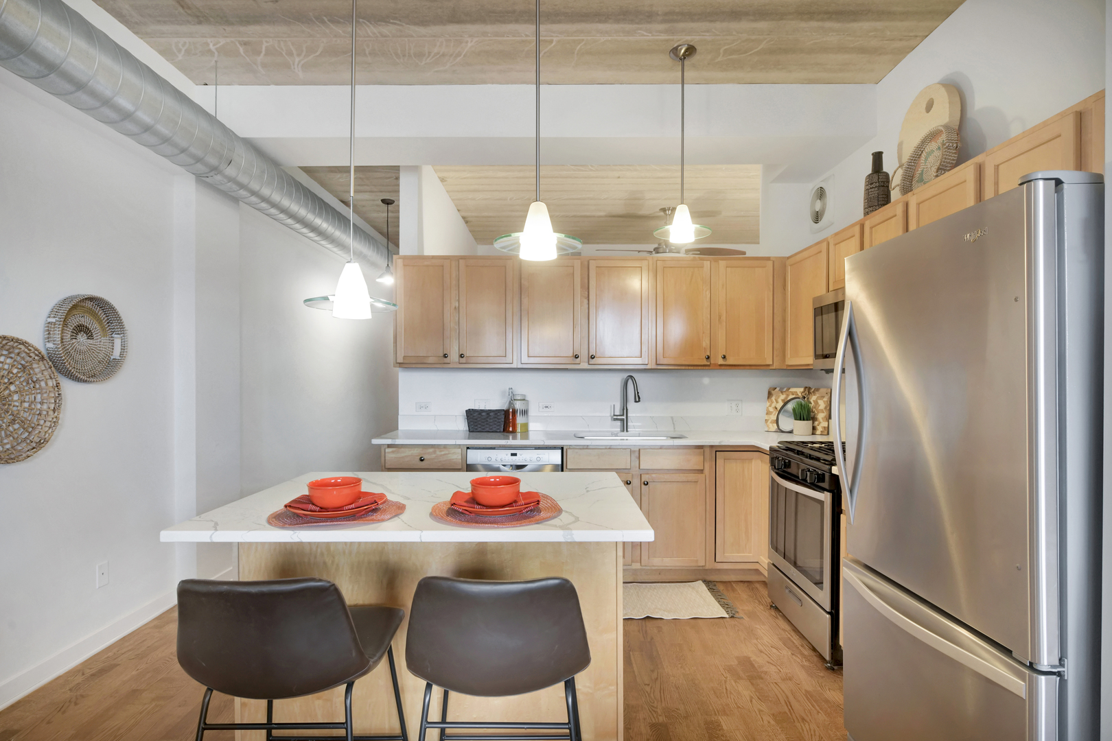 3260 North Clark Street, Unit 407 Chicago, IL 60657 - Photo 3 of 18 a kitchen with a refrigerator a sink and cabinets