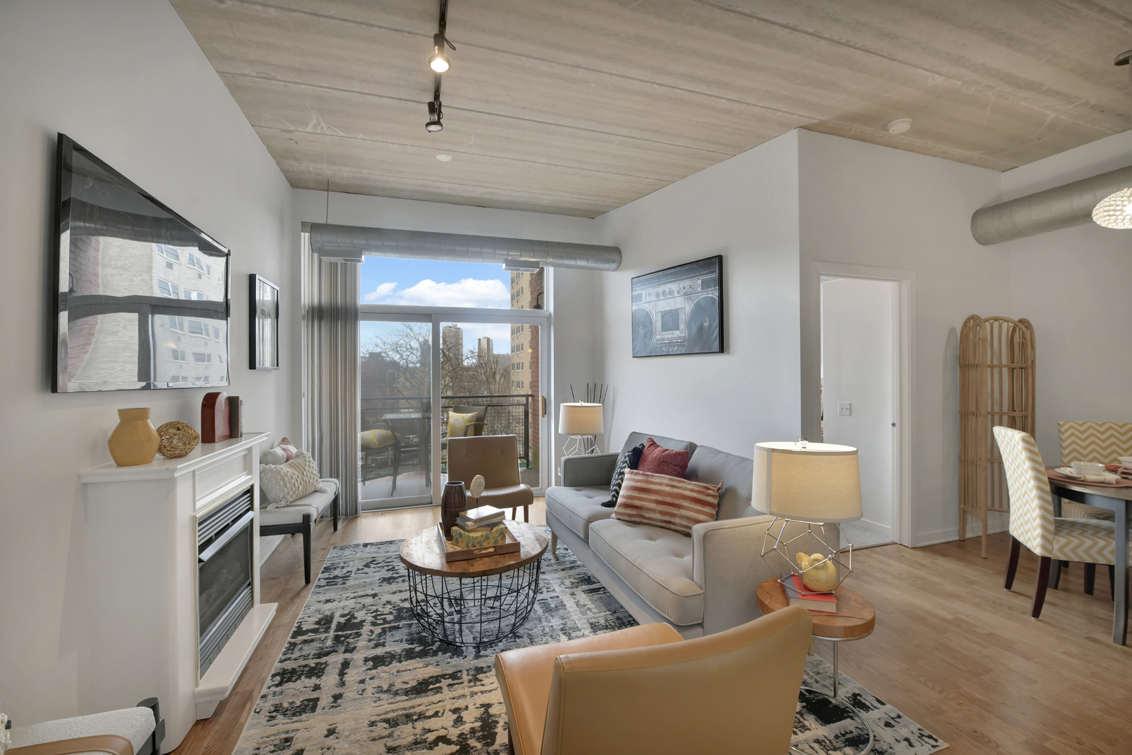3260 North Clark Street, Unit 407 Chicago, IL 60657 - Photo 8 of 18 a living room with furniture and wooden floor