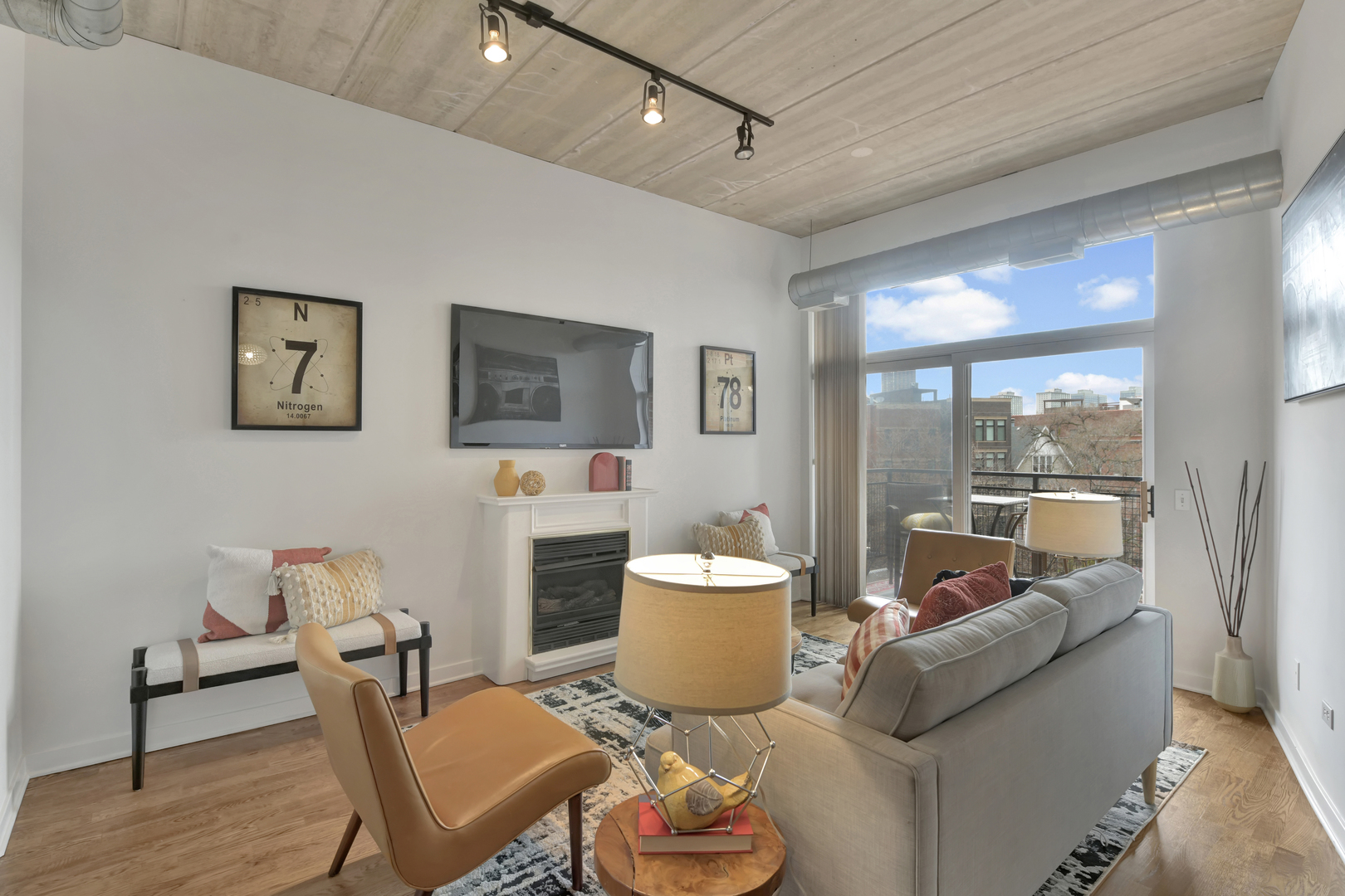 3260 North Clark Street, Unit 407 Chicago, IL 60657 - Photo 9 of 18 a living room with furniture and a large window