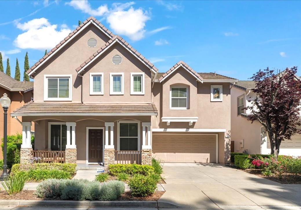 105 Estrada Drive Mountain View, CA 94043 - Photo 1 of 1 a front view of a house with a yard and garage