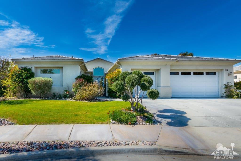 19 Napoleon Road Rancho Mirage, CA 92270 - Photo 1 of 41 a front view of a house with a yard and potted plants