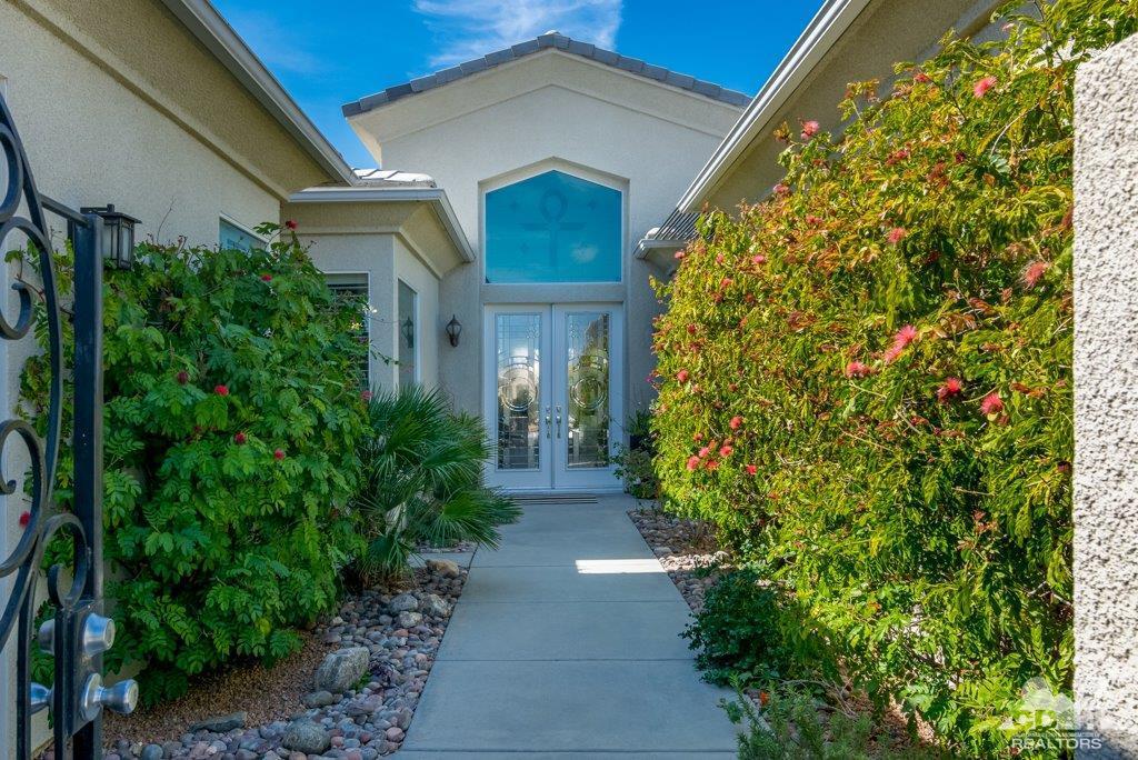 19 Napoleon Road Rancho Mirage, CA 92270 - Photo 2 of 41 a view of house with garden