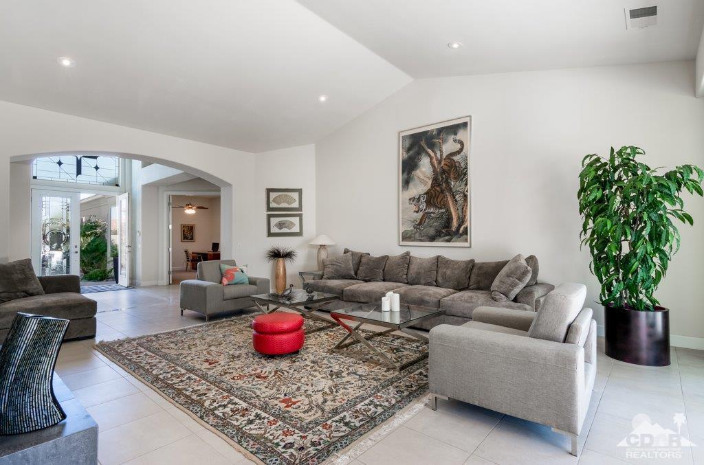 19 Napoleon Road Rancho Mirage, CA 92270 - Photo 11 of 41 a living room with furniture and a chandelier