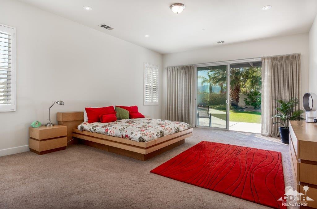 19 Napoleon Road Rancho Mirage, CA 92270 - Photo 13 of 41 a bedroom with a bed and a couch