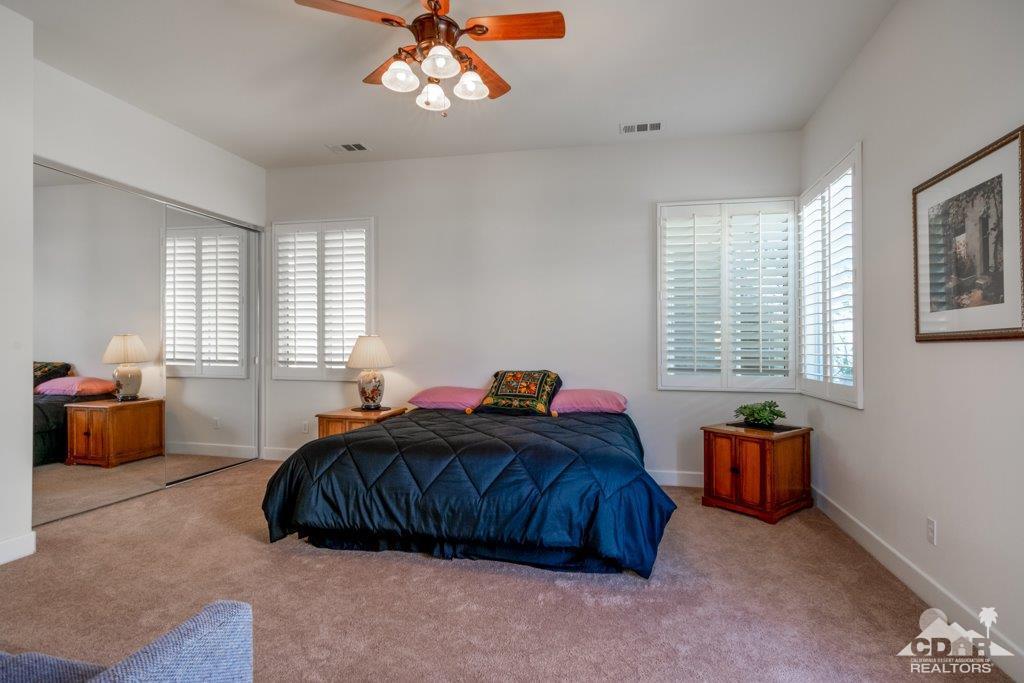 19 Napoleon Road Rancho Mirage, CA 92270 - Photo 15 of 41 a bedroom with a bed and a window