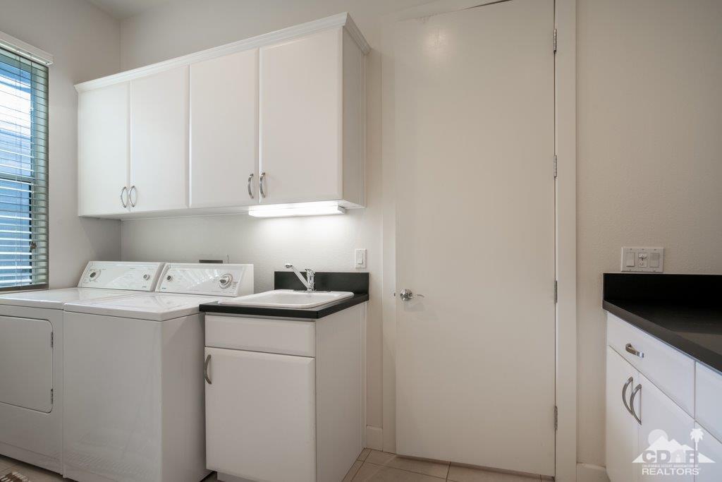 19 Napoleon Road Rancho Mirage, CA 92270 - Photo 18 of 41 a utility room with sink dryer and washer