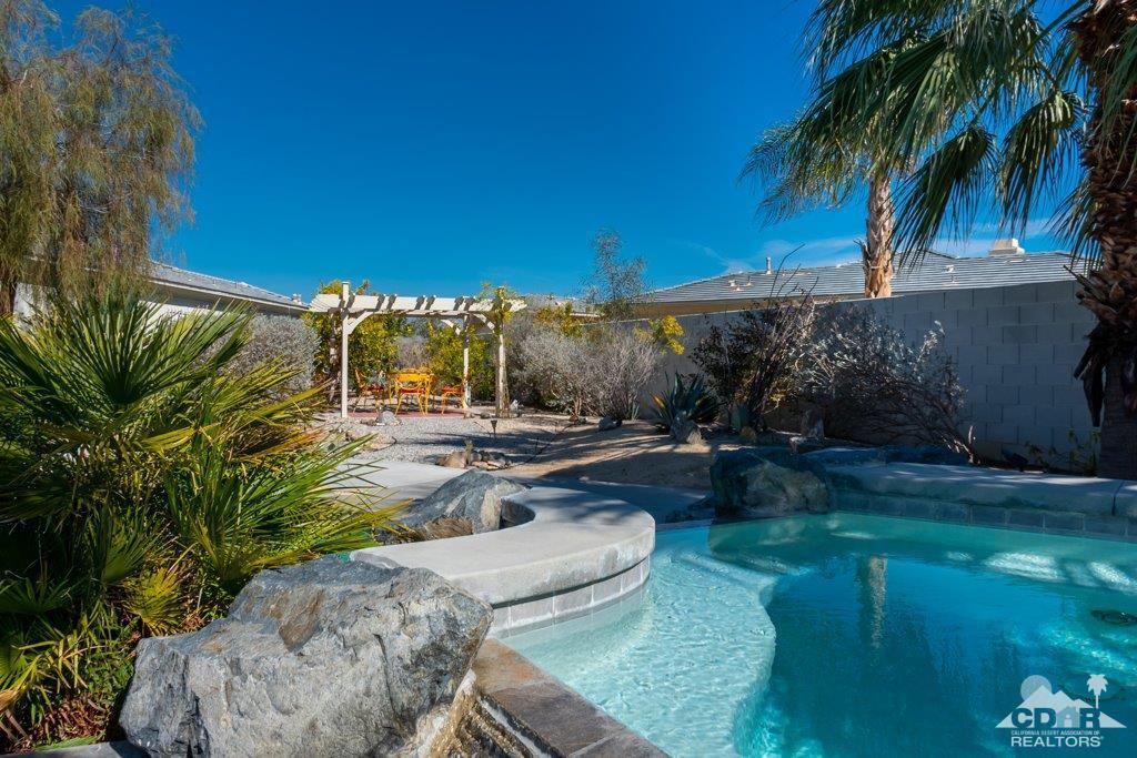 19 Napoleon Road Rancho Mirage, CA 92270 - Photo 20 of 41 a view of a backyard with plants and outdoor seating