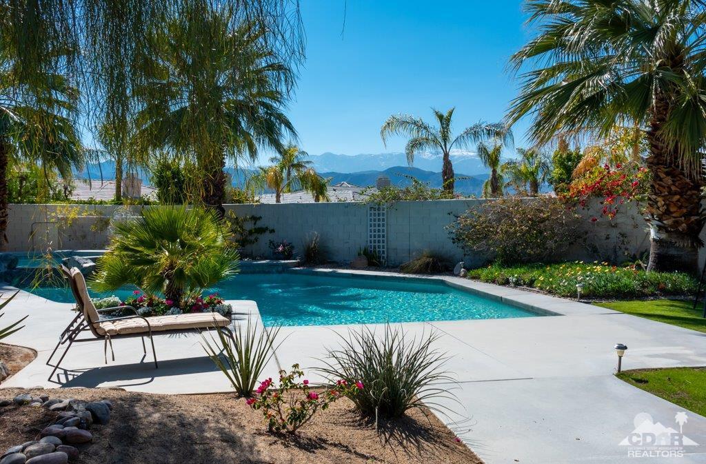 19 Napoleon Road Rancho Mirage, CA 92270 - Photo 24 of 41 a view of a backyard with plants and palm tree