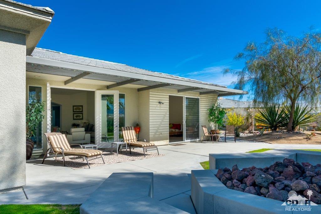 19 Napoleon Road Rancho Mirage, CA 92270 - Photo 33 of 41 a view of a house with backyard and sitting area