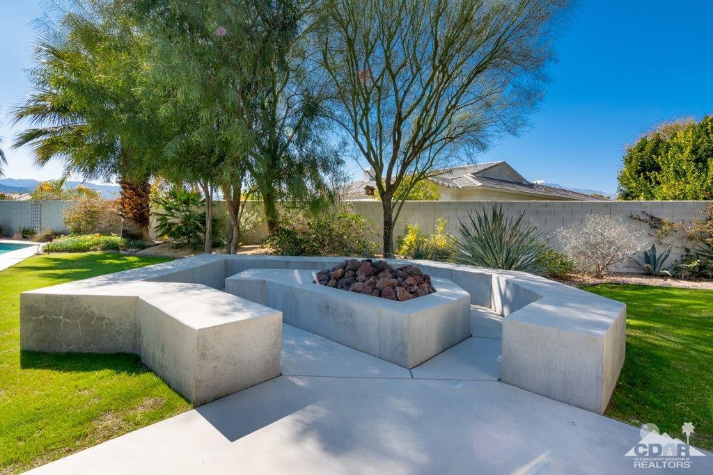 19 Napoleon Road Rancho Mirage, CA 92270 - Photo 34 of 41 a view of a patio with couches and a fire pit