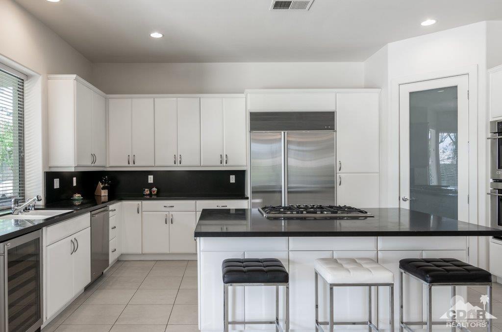 19 Napoleon Road Rancho Mirage, CA 92270 - Photo 6 of 41 a kitchen with a sink cabinets and window