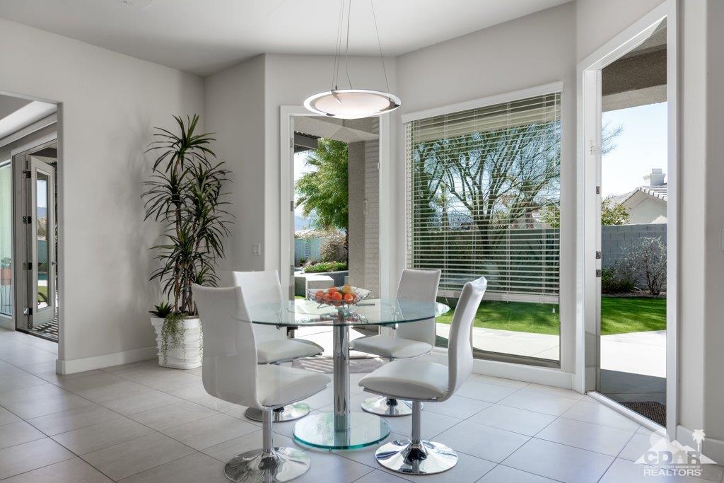 19 Napoleon Road Rancho Mirage, CA 92270 - Photo 9 of 41 a dining room with furniture window and outside view
