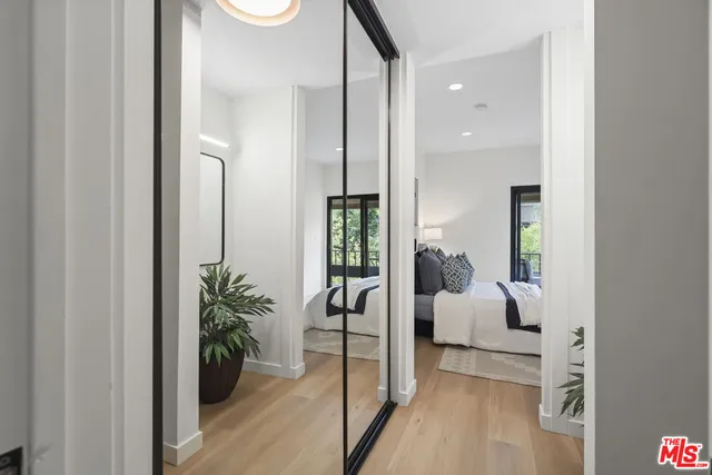 a bathroom with a glass shower door and mirror