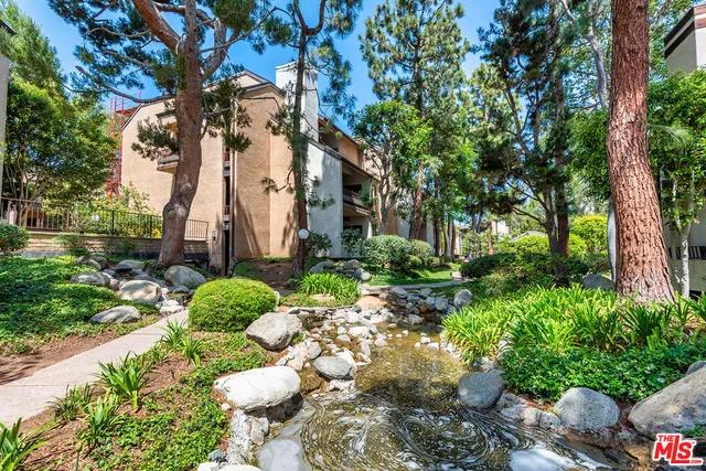 a view of a house with a garden