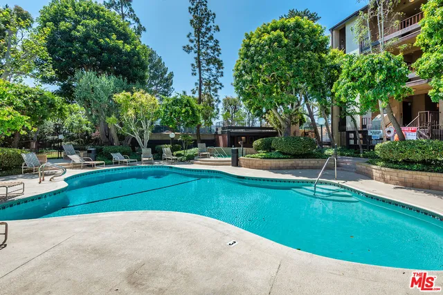 a view of a swimming pool with a patio