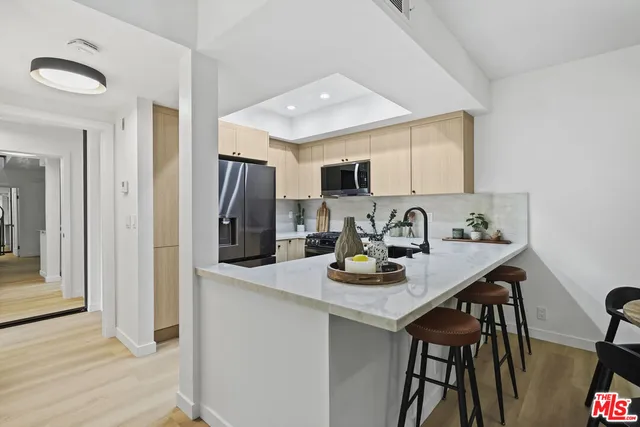 a kitchen with a sink stove and microwave