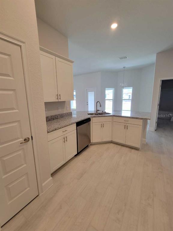 4626 Southwest 103rd Street Road Ocala, FL 34476 - Photo 13 of 29 a view of a kitchen with a sink cabinets and a window