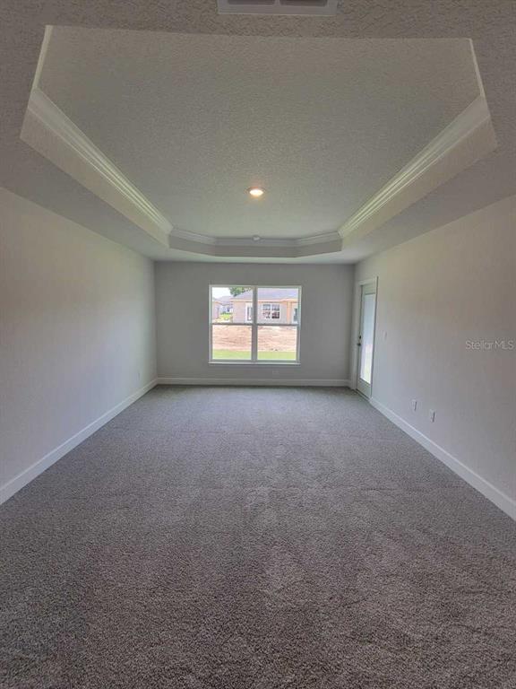 4626 Southwest 103rd Street Road Ocala, FL 34476 - Photo 19 of 29 a view of a big room with windows and chandelier fan