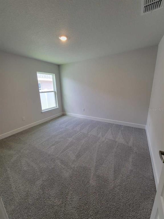 4626 Southwest 103rd Street Road Ocala, FL 34476 - Photo 24 of 29 an empty room with windows