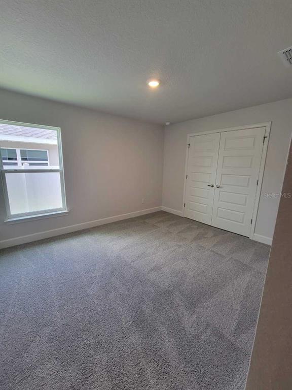 4626 Southwest 103rd Street Road Ocala, FL 34476 - Photo 26 of 29 a view of an empty room with a window