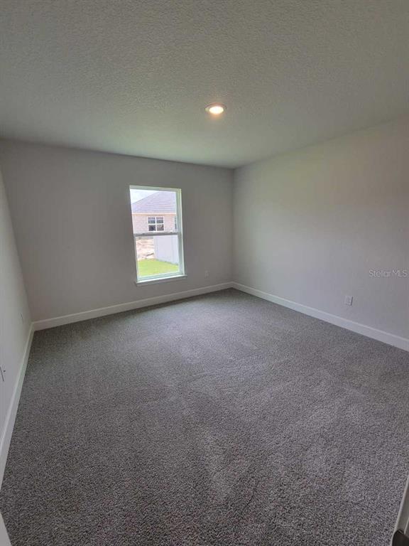 4626 Southwest 103rd Street Road Ocala, FL 34476 - Photo 27 of 29 a view of an empty room with a window