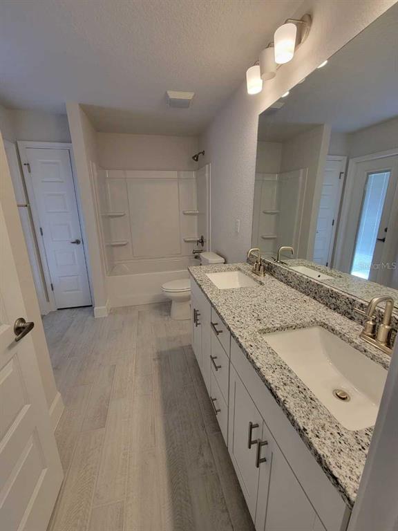 4626 Southwest 103rd Street Road Ocala, FL 34476 - Photo 28 of 29 a bathroom with a granite countertop double vanity sink and mirror