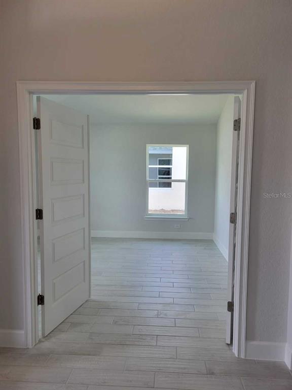 4626 Southwest 103rd Street Road Ocala, FL 34476 - Photo 4 of 29 a view of an empty room with window