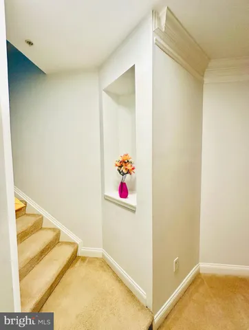 a bedroom with a large bed and a flat screen tv