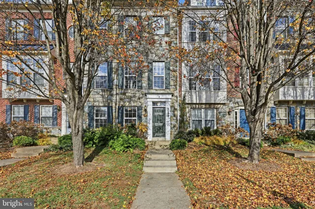 a view of a pathway with a house in the background
