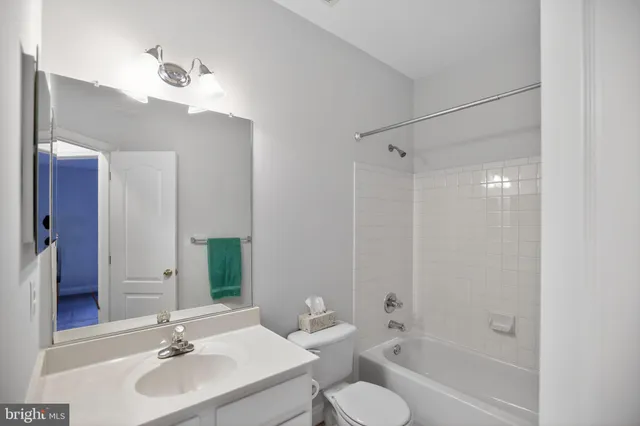 a bathroom with a bathtub and a sink