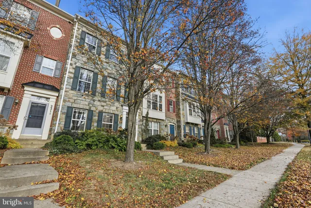 a view of a brick building next to a yard