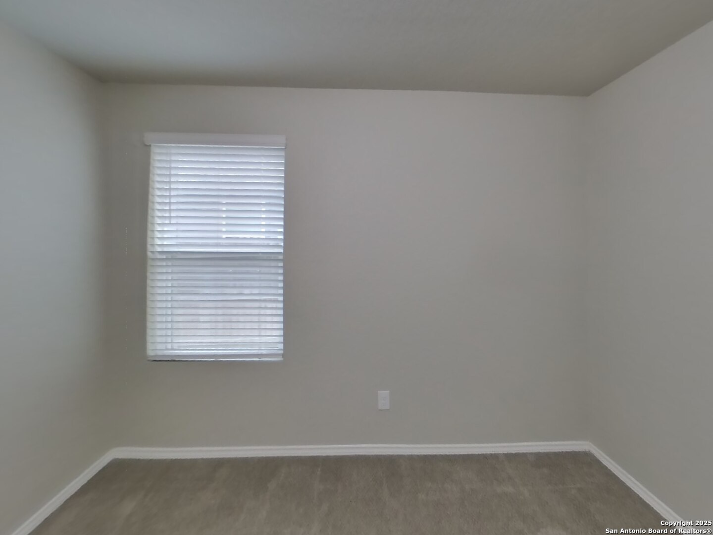 8718 Segura Way San Antonio, TX 78254 - Photo 12 of 16 an empty room with a window