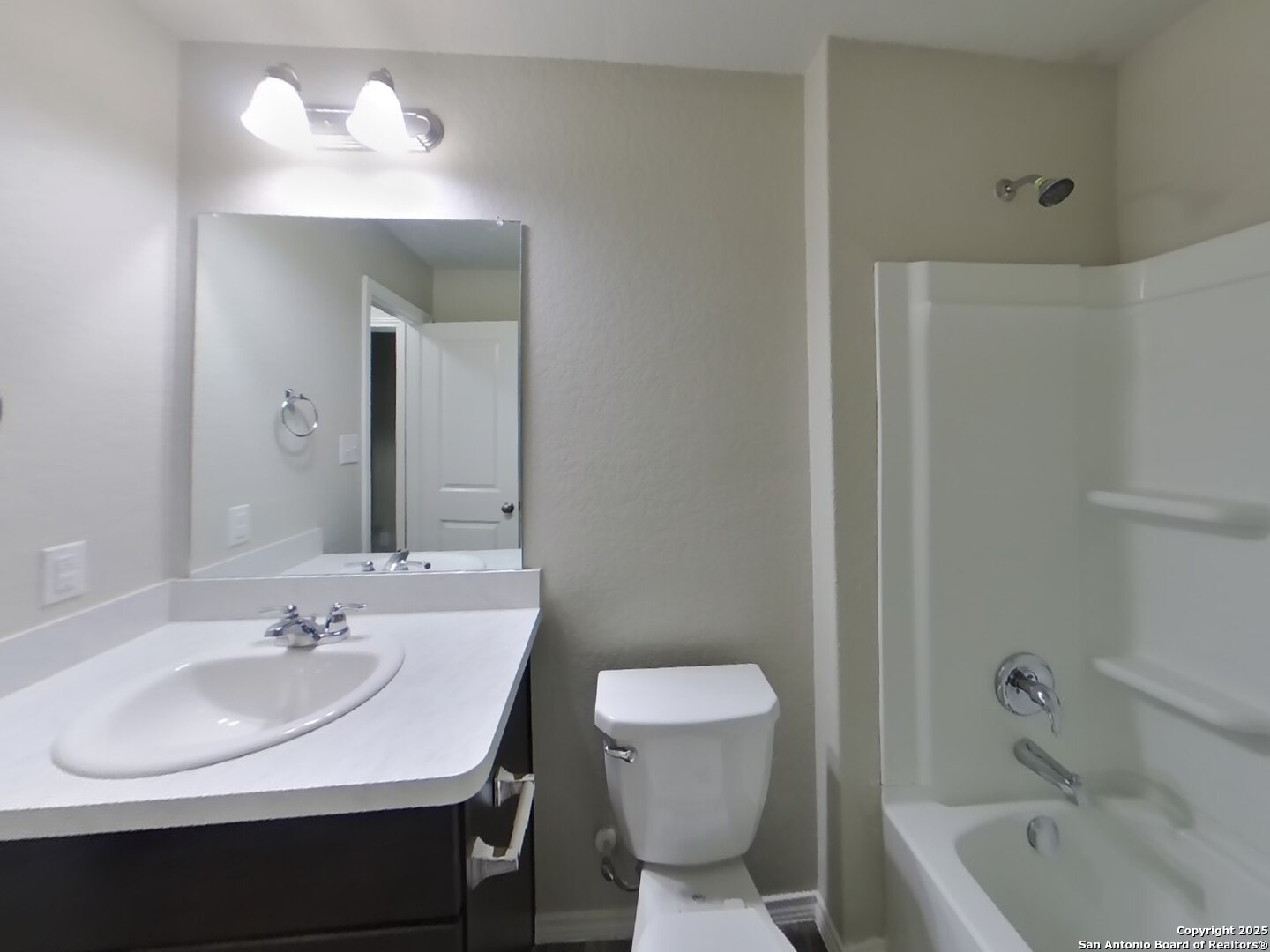 8718 Segura Way San Antonio, TX 78254 - Photo 13 of 16 a bathroom with a sink and a mirror
