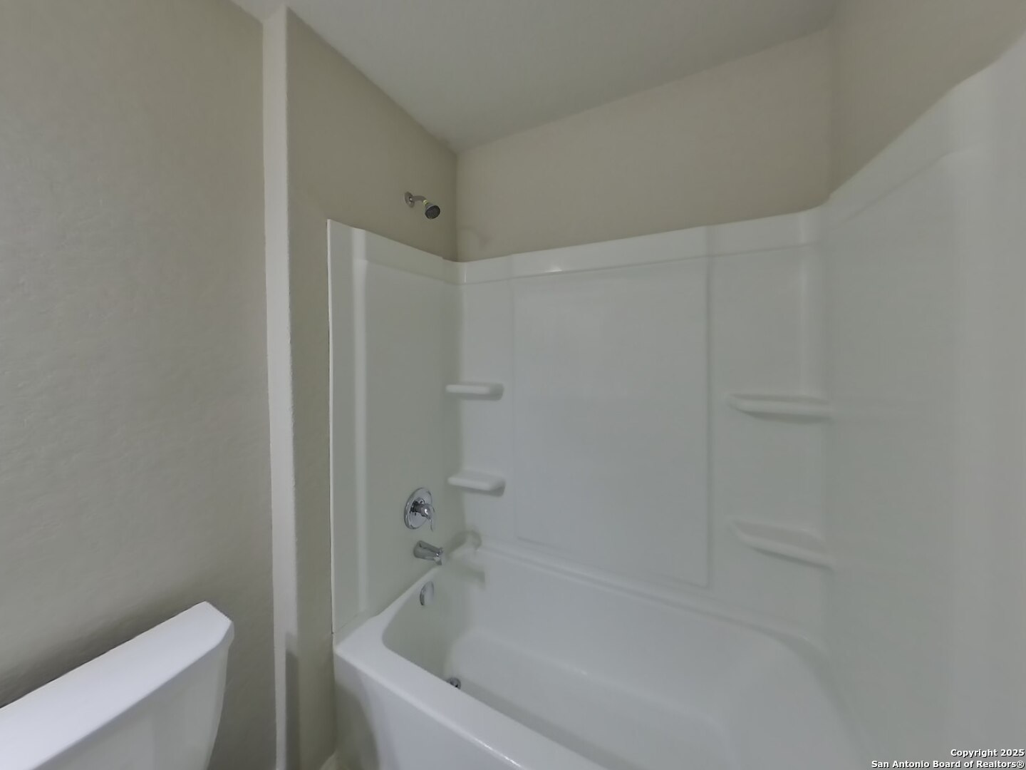 8718 Segura Way San Antonio, TX 78254 - Photo 14 of 16 a white bath tub sitting next to a toilet
