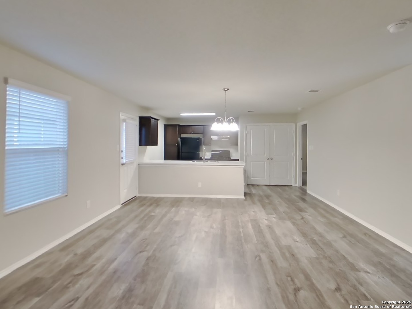 8718 Segura Way San Antonio, TX 78254 - Photo 4 of 16 a view of a kitchen with a sink and a refrigerator