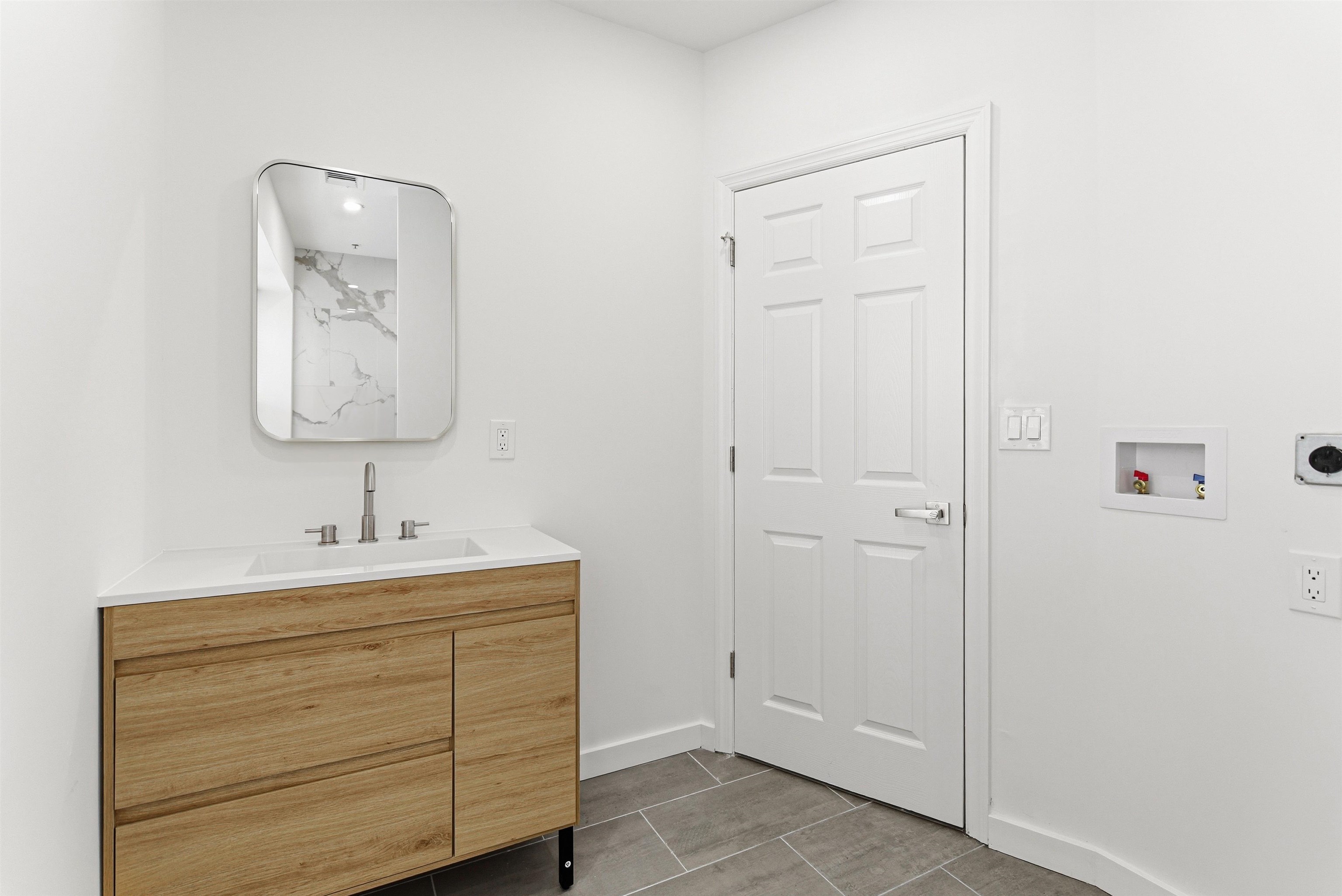 419 5th Street, Unit B Hoboken, NJ 07030 - Photo 11 of 19 a room with a door and a mirror