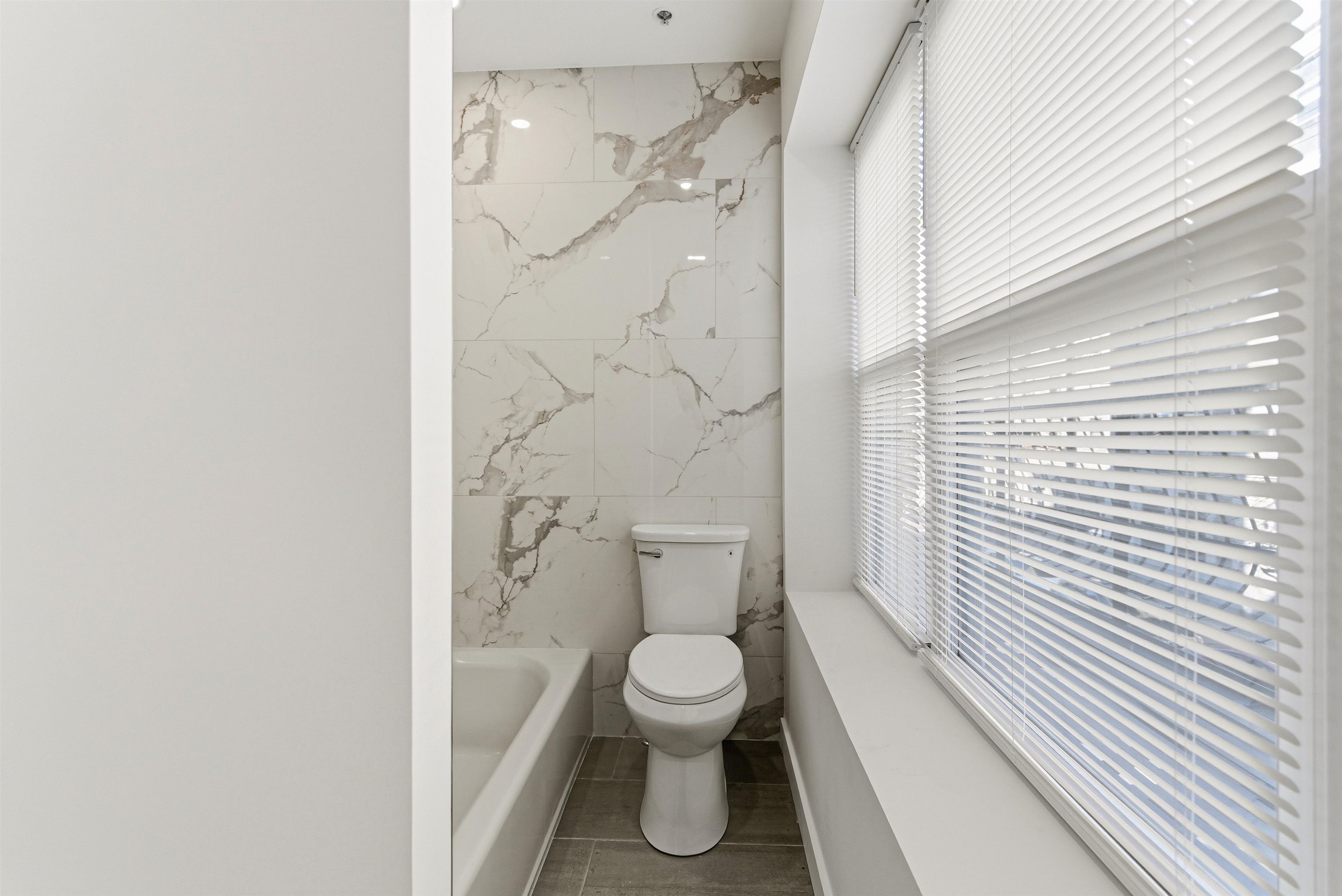 419 5th Street, Unit B Hoboken, NJ 07030 - Photo 12 of 19 a bathroom with a toilet and a shower