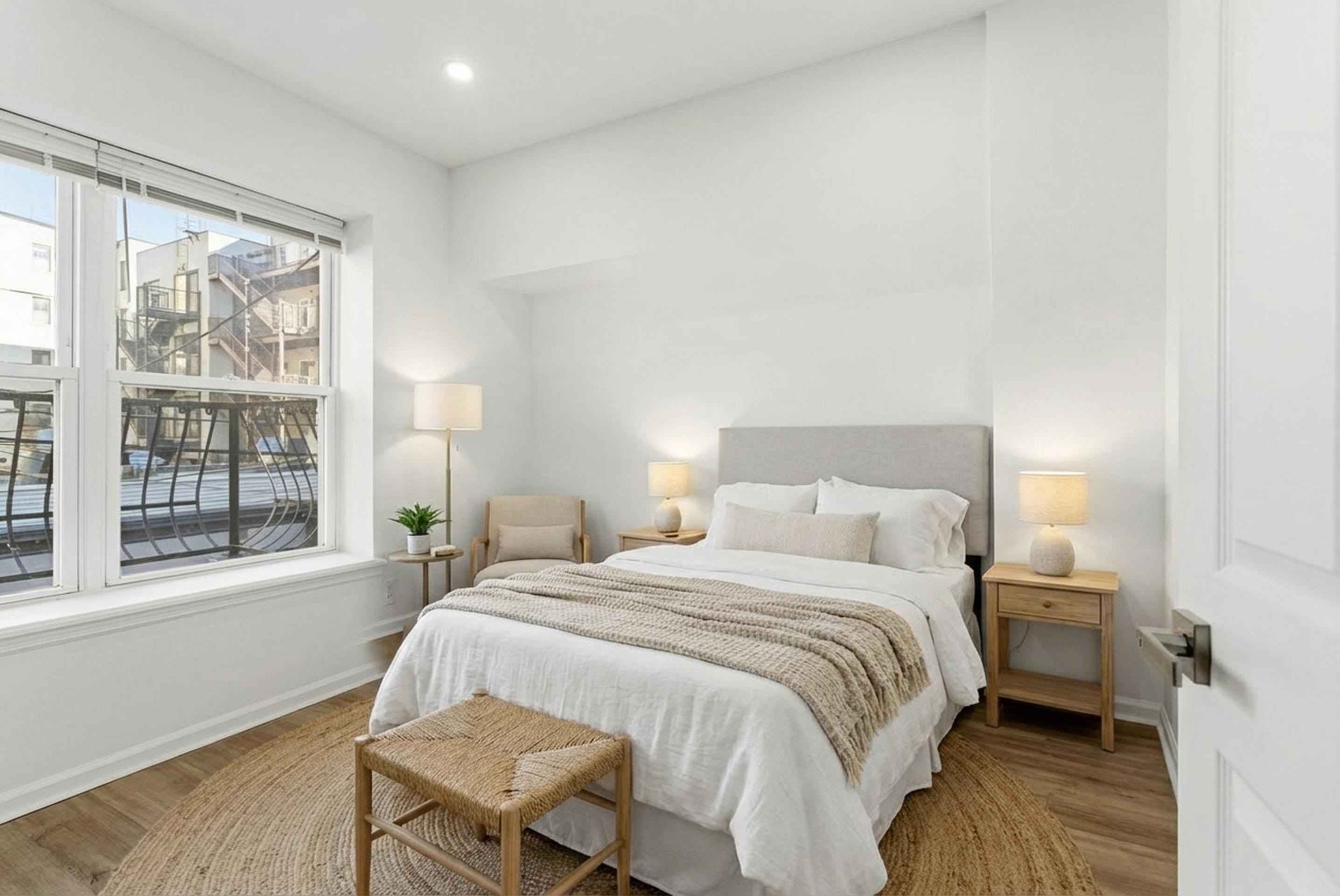 419 5th Street, Unit B Hoboken, NJ 07030 - Photo 15 of 19 a bedroom with a bed and a large window