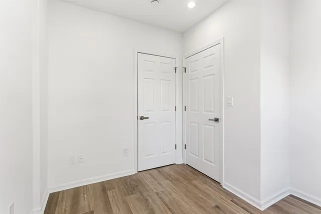 a view of entryway with wooden floor and a window