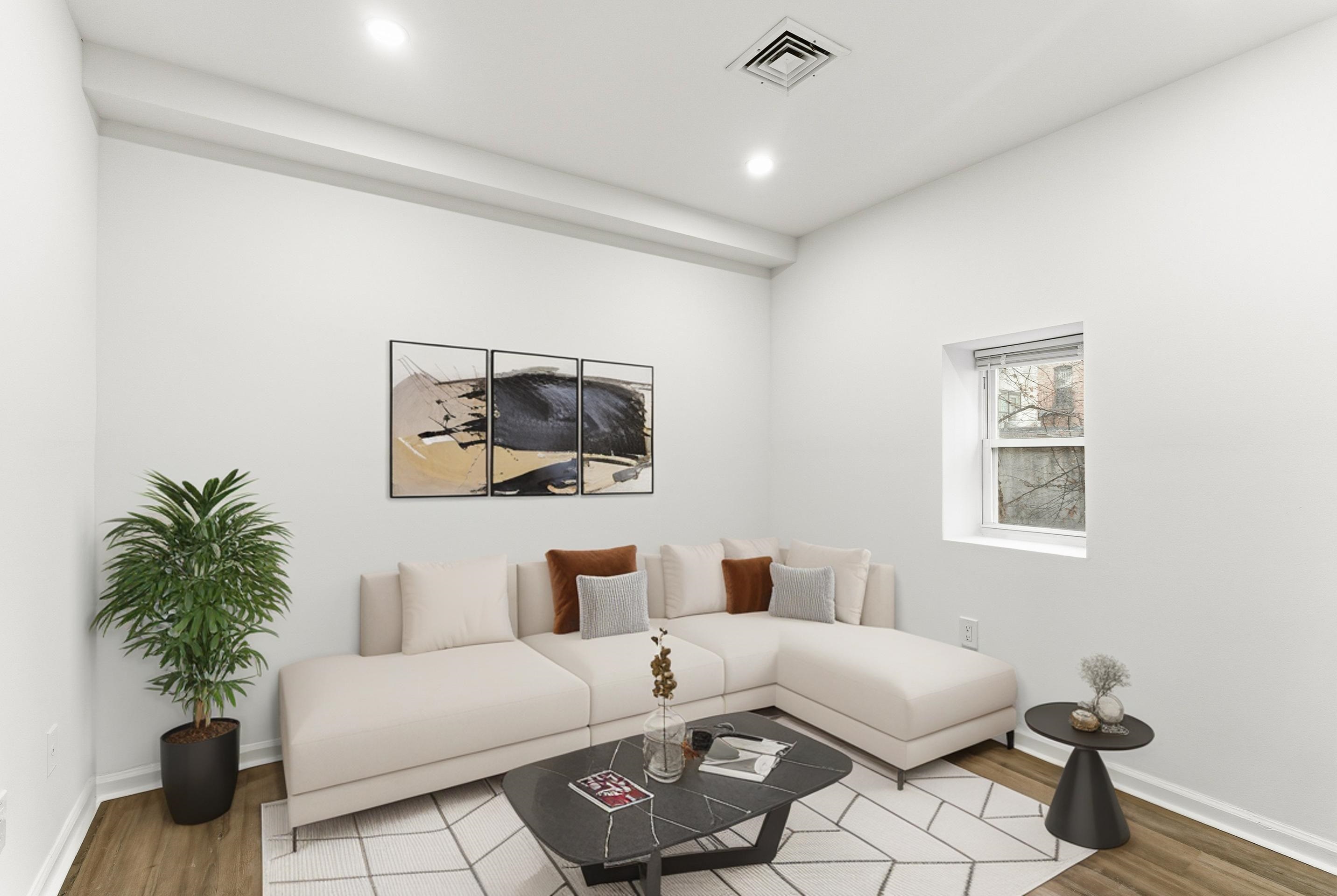 419 5th Street, Unit B Hoboken, NJ 07030 - Photo 5 of 19 a living room with furniture and a potted plant
