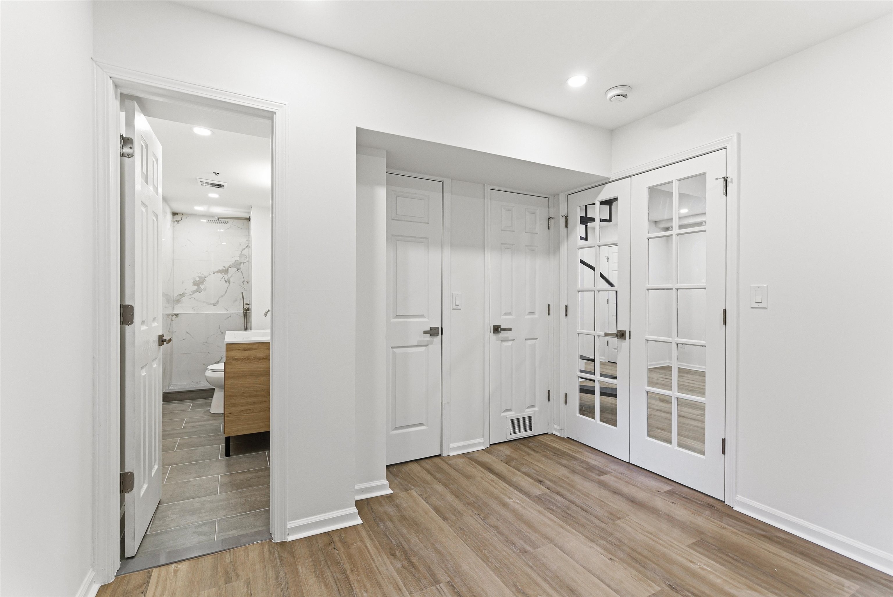 419 5th Street, Unit B Hoboken, NJ 07030 - Photo 6 of 19 wooden floor and closet in a bathroom