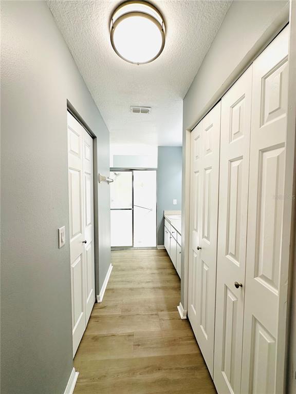 9706 Southwest 92nd Place Road Ocala, FL 34481 - Photo 19 of 82 a view of a room with wooden floor and windows
