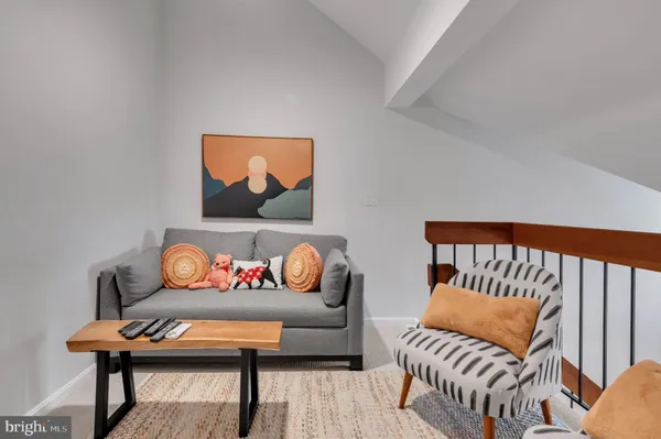 a bedroom with furniture and a flat screen tv