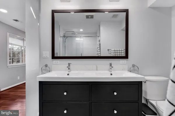 a bathroom with a glass shower door