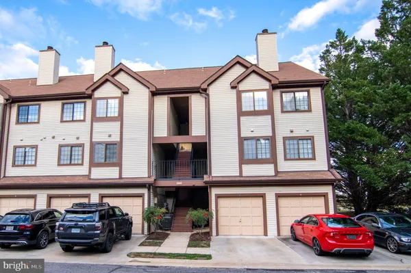 a front view of a house with parking space