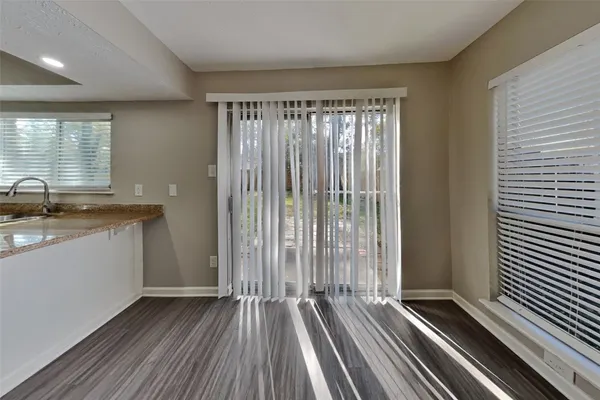 a view of outdoor space with wooden floor