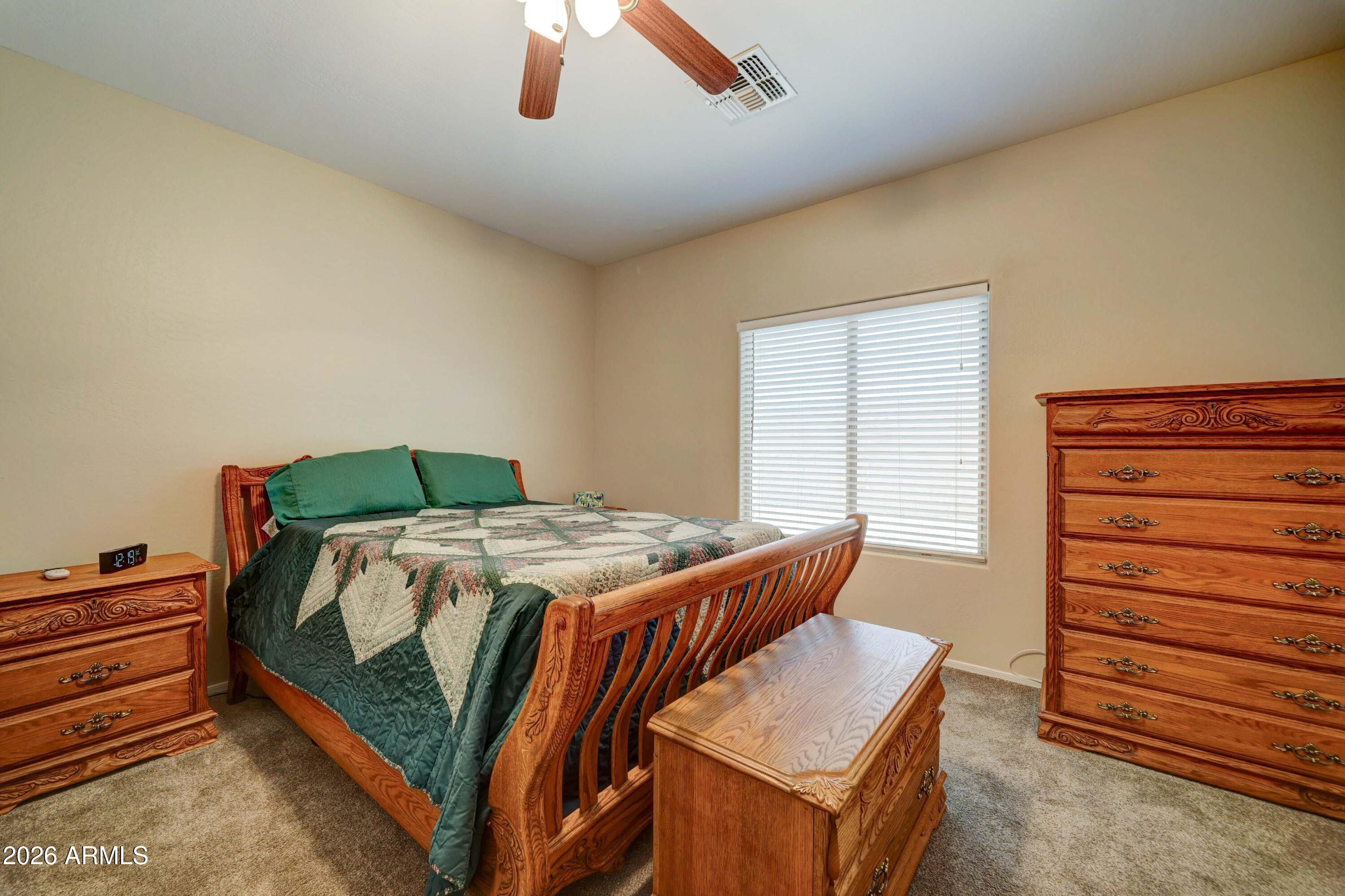2101 South Meridian Road, Unit 164 Apache Junction, AZ 85120 - Photo 13 of 56 a bedroom with a bed and a dresser