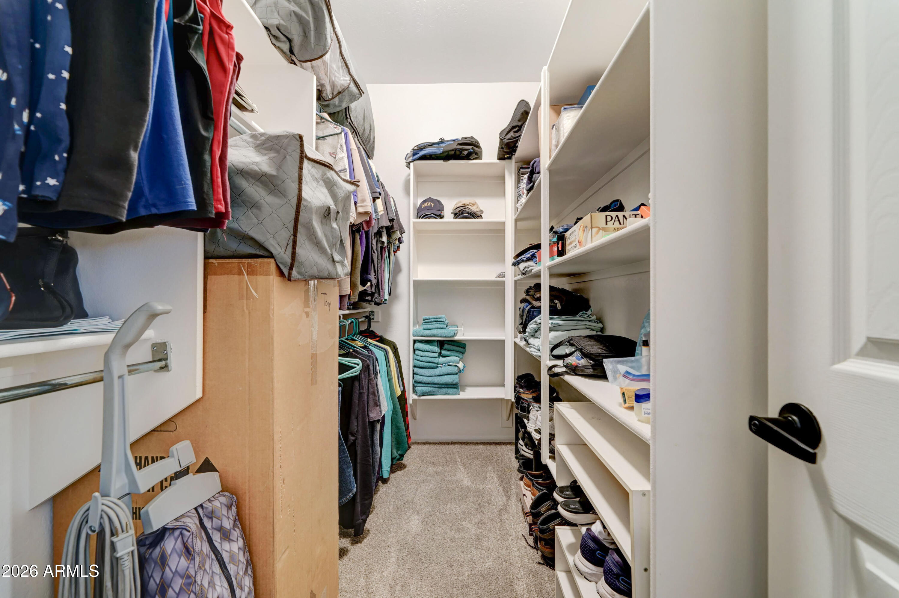 2101 South Meridian Road, Unit 164 Apache Junction, AZ 85120 - Photo 17 of 56 a view of walk in closet with clothes and shoes